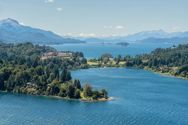 The Llao Llao peninsula between two arms of Lake Nahuel Huapi with mountains behind