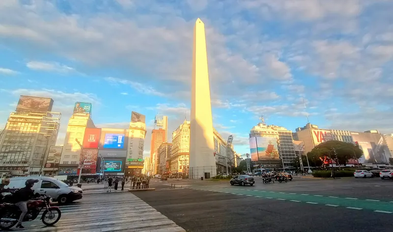 The Obelisco monument in Buenos Aires at sunset with wide avenues around it