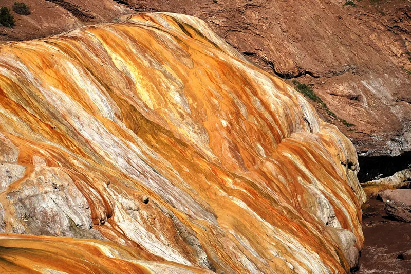 The natural rock bridge of Puente del Inca coloured by mineral springs