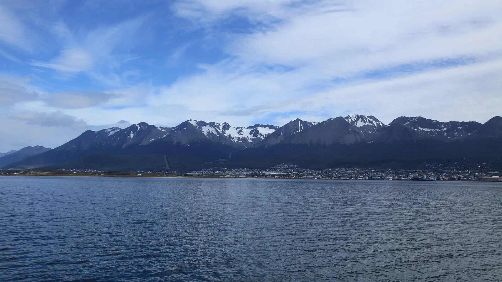 The town of Ushuaia beside the Beagle Channel with snow-capped mountains behind