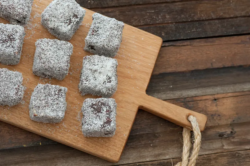 Lamington sponge cakes coated in chocolate and coconut