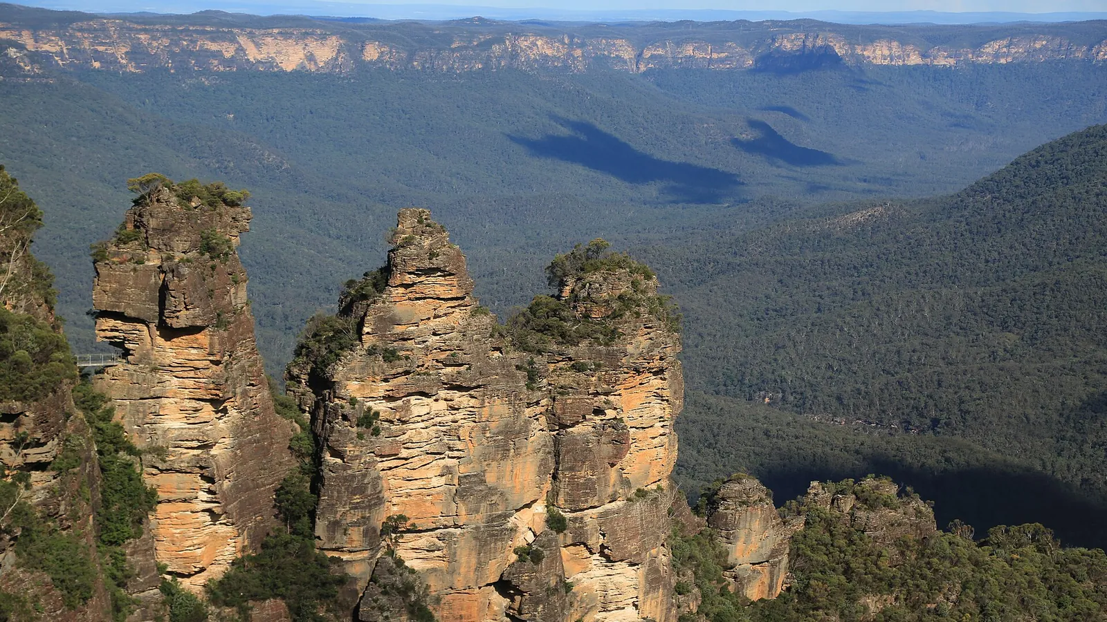 The Three Sisters rock formation above the forested Jamison Valley in the Blue Mountains