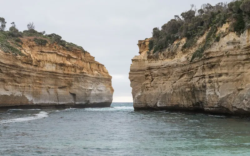 The sheltered beach and cliffs of Loch Ard Gorge on the Victorian coast