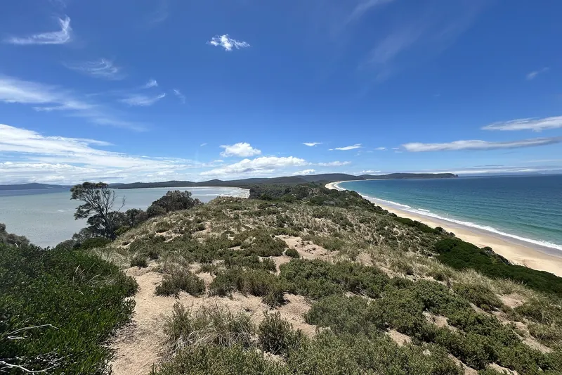 The narrow sandy isthmus known as The Neck on Bruny Island