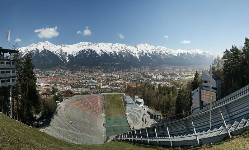 Innsbruck's old town with the snow-capped Nordkette mountains rising directly behind it