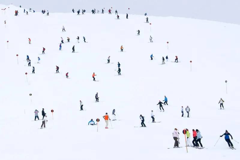 Skiers on a slope in the Austrian Alps