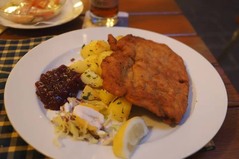 A Wiener schnitzel with parsley potatoes
