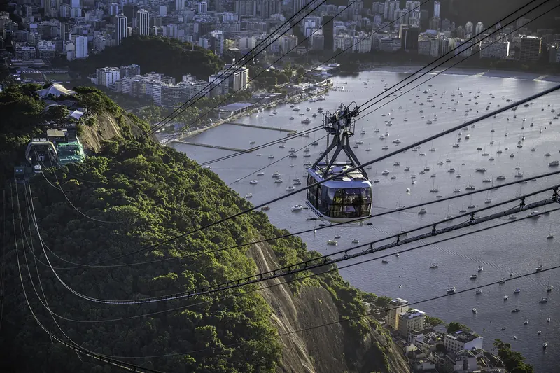 The cable car ascending to Sugarloaf Mountain over Guanabara Bay