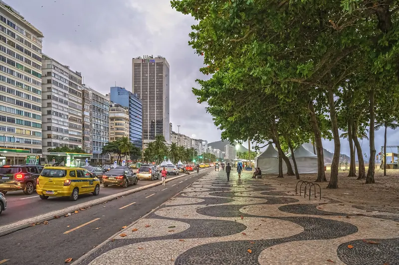 The curving Copacabana beach with buildings and mountains behind