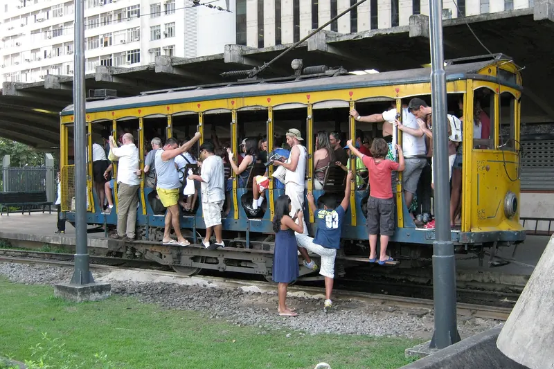 A yellow Santa Teresa tram at its station in Rio