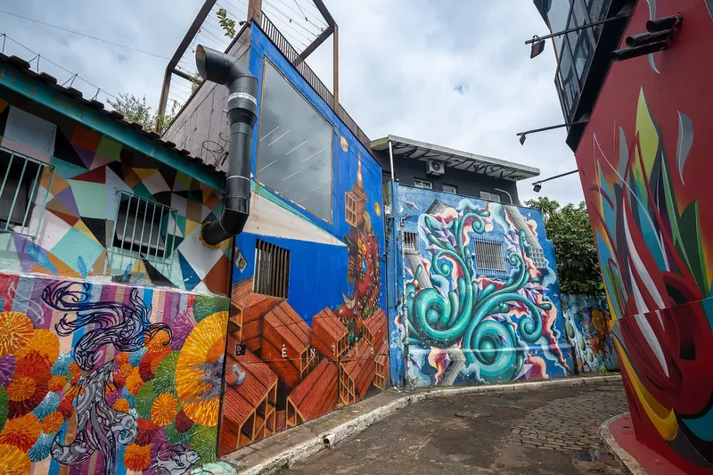 Colourful murals and street art covering the walls of Beco do Batman