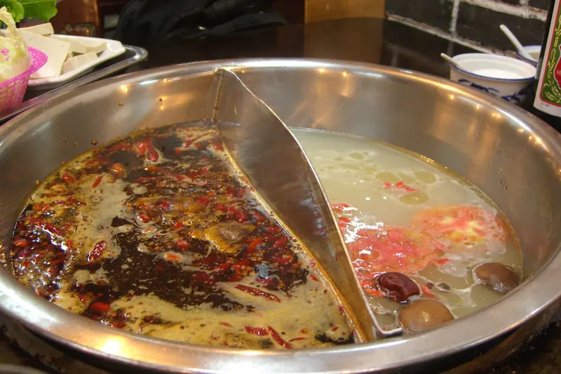 A bubbling pot of fiery mala Sichuan hotpot broth