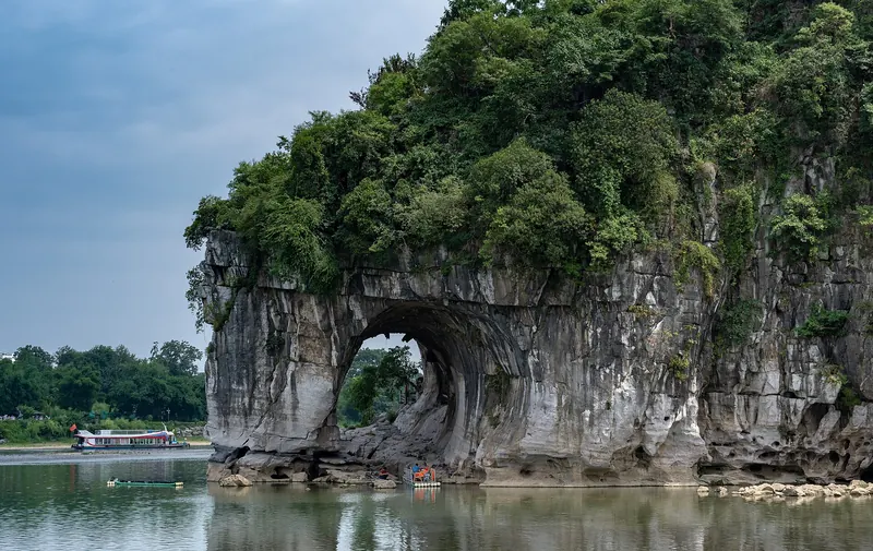 Elephant Trunk Hill, its arch dipping into the river like a trunk