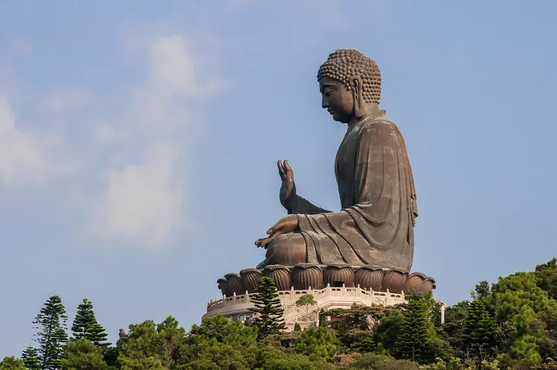 The bronze Tian Tan Buddha seated on a hilltop on Lantau Island