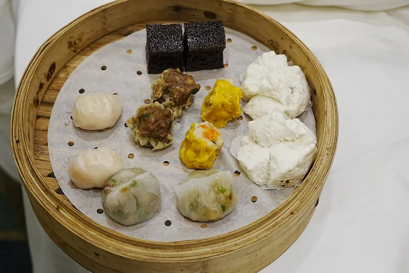 A selection of eight different dim sum dishes