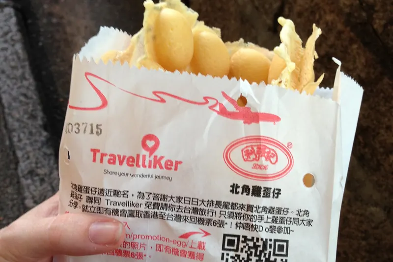 A bubble-shaped egg waffle, crisp outside and soft within