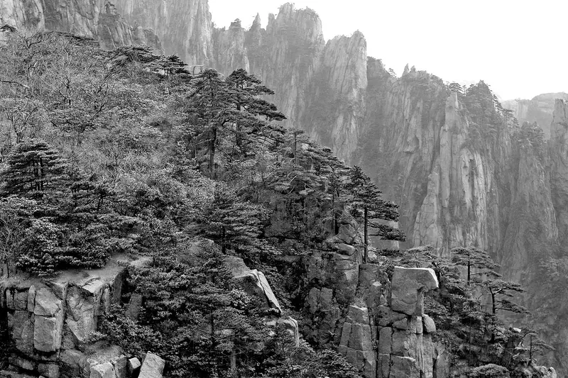 Stone-cut trail steps climbing toward a Huangshan summit