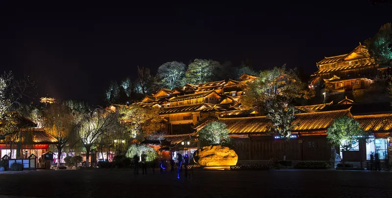 Lijiang Old Town's lanes and rooftops lit up at night