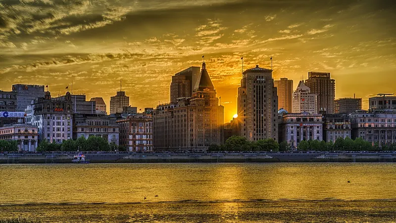 The Bund and Pudong's skyline lit up at dusk