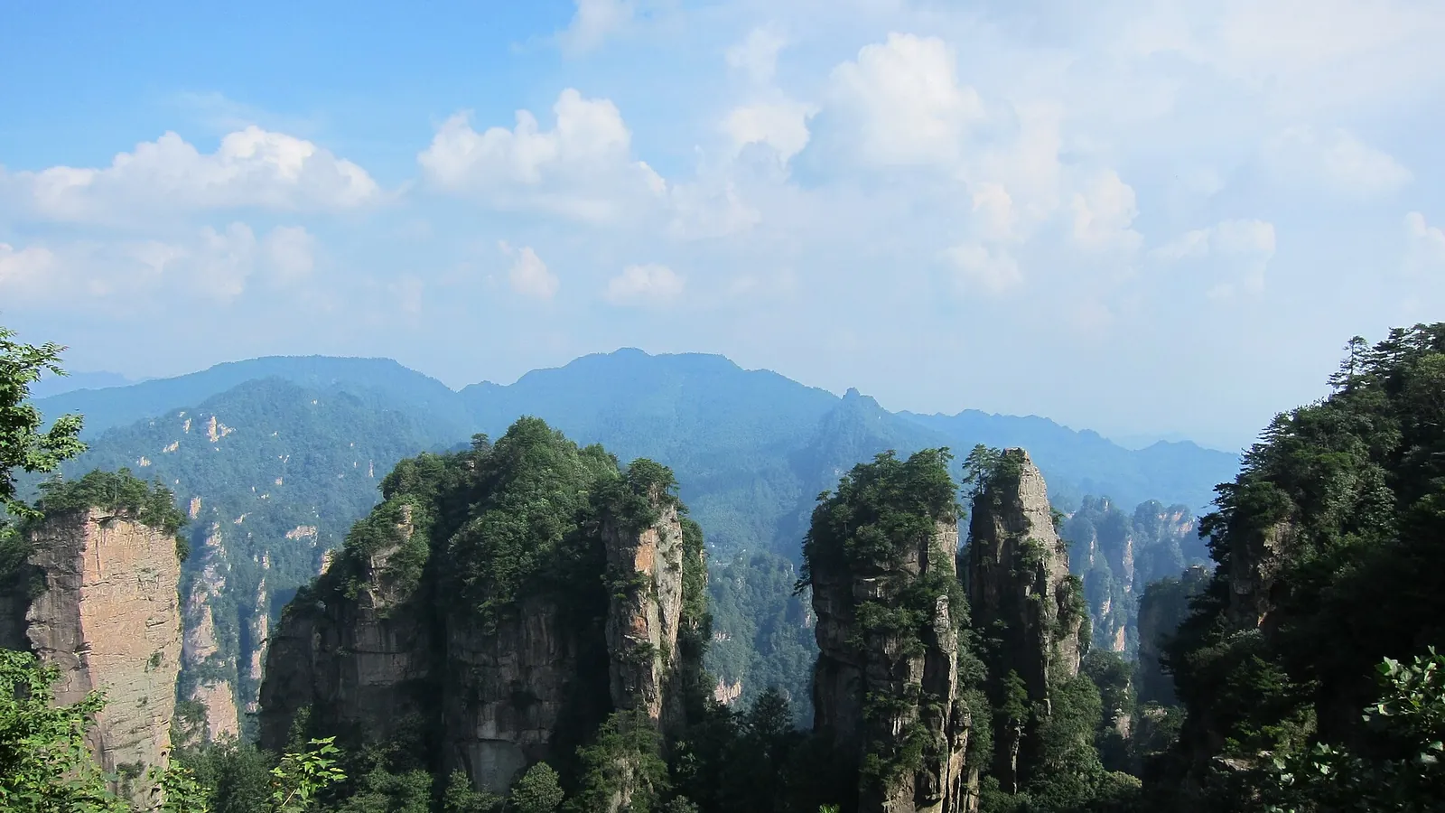 Thousands of sandstone pillars rising through mist in Zhangjiajie National Forest Park