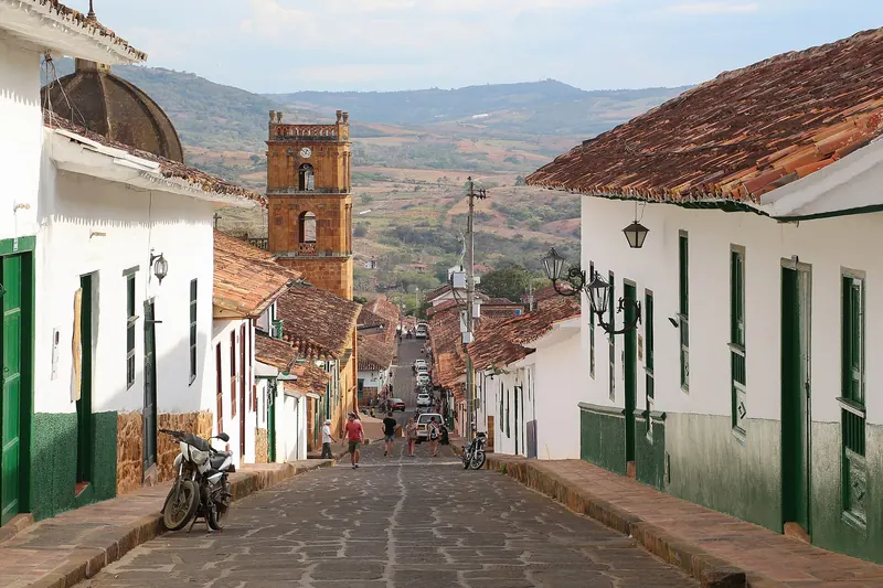 A stone-paved street lined with whitewashed houses in Barichara