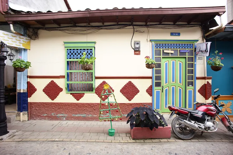 Brightly painted zócalo panels on the houses of Guatapé