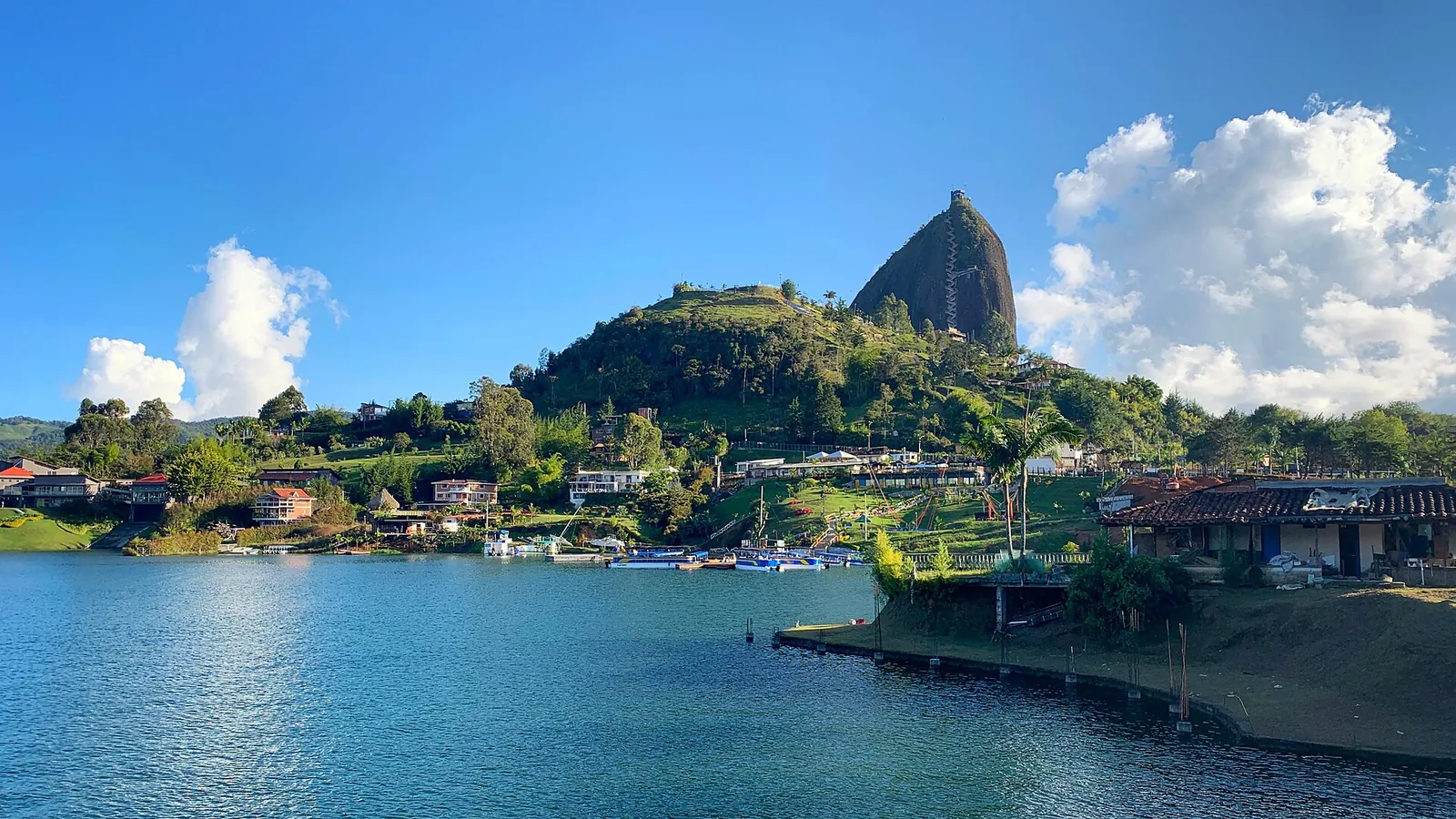 The giant granite monolith of El Peñol rising above the Guatapé reservoir