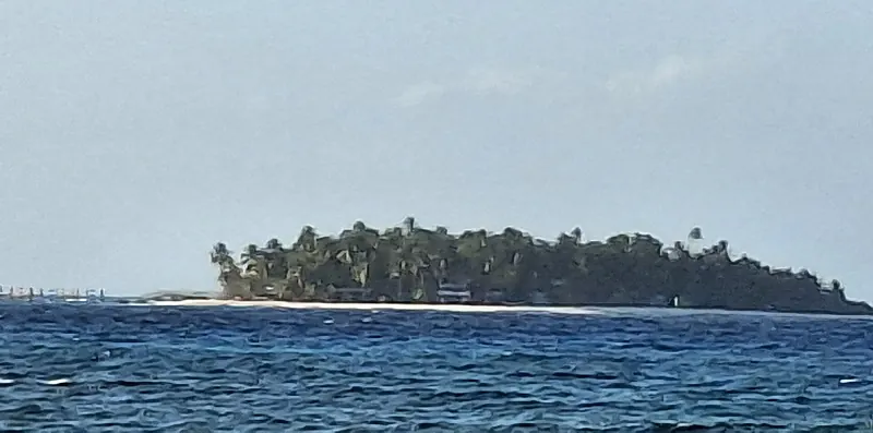 The palm-covered Johnny Cay seen across the water from San Andrés