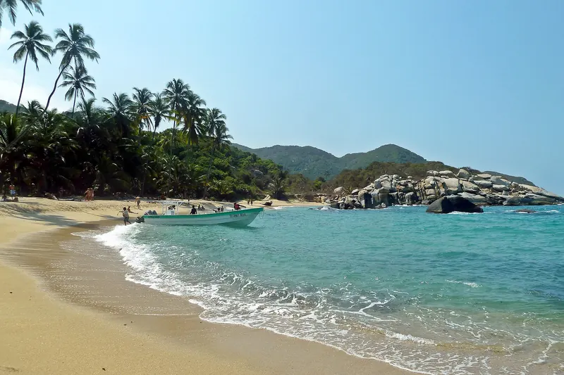 Cabo San Juan beach in Tayrona National Park with palms and boulders