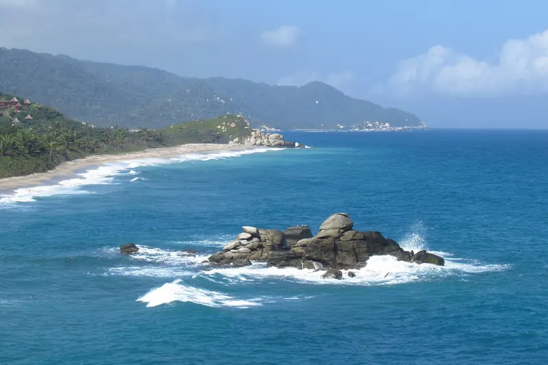 A jungle-backed cove at Tayrona National Park with turquoise water