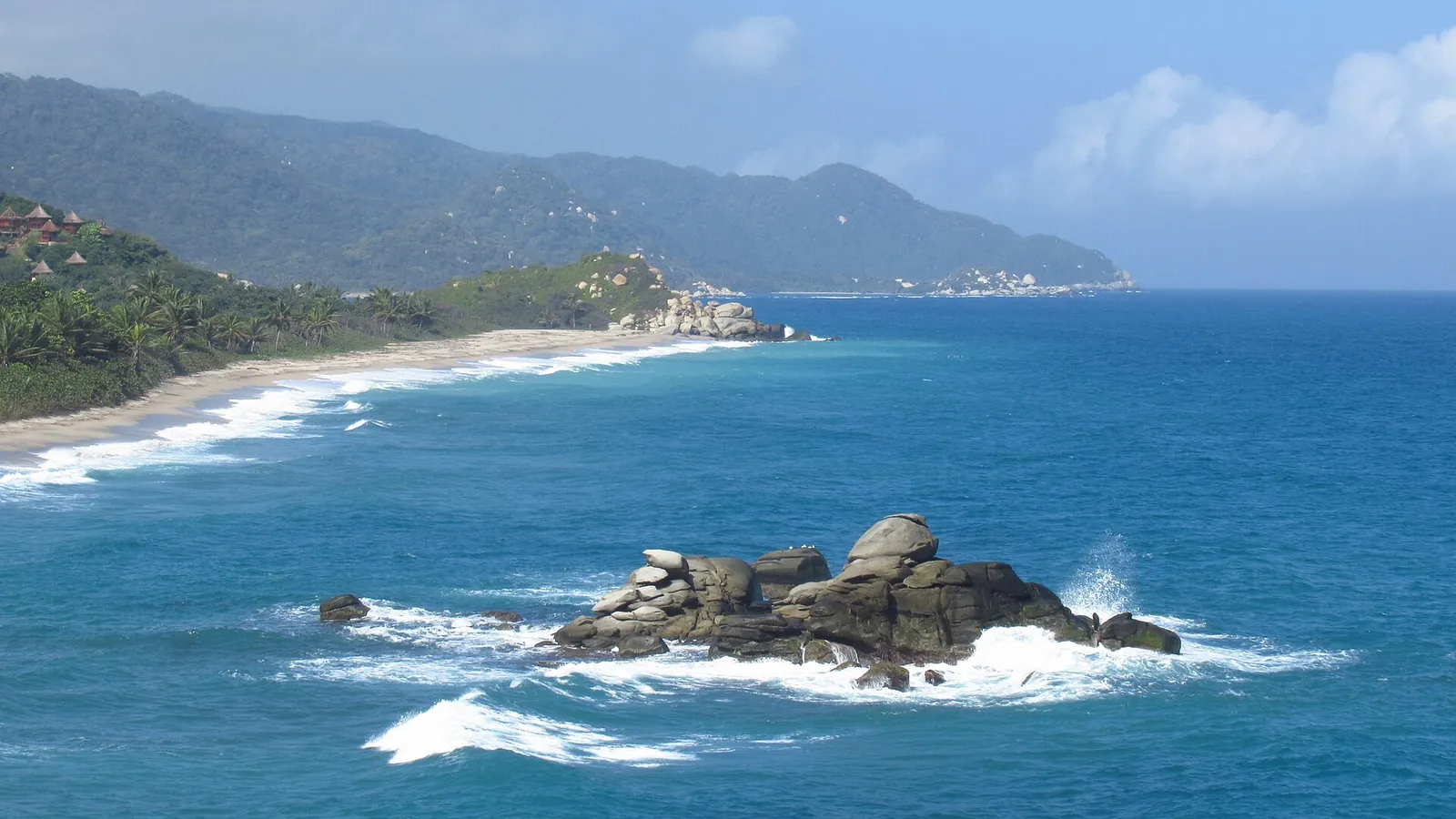 A jungle-backed cove at Tayrona National Park with turquoise water