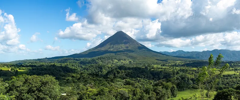 The conical Arenal volcano rising above the rainforest