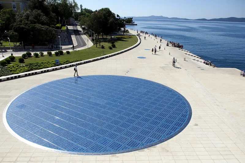 The Monument to the Sun lit up at night in Zadar