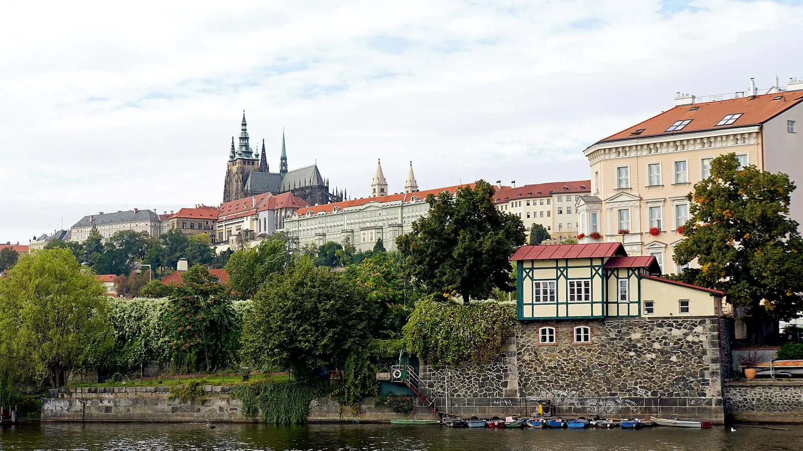 Prague's skyline along the Vltava River, with St Vitus Cathedral rising above Prague Castle