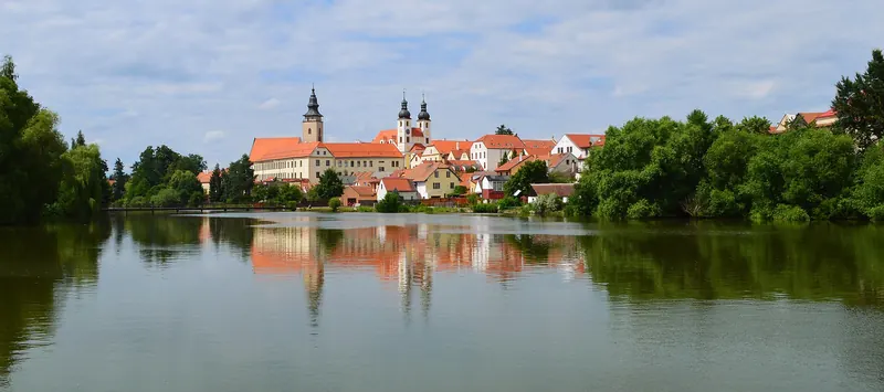 Telč's old town reflected in its surrounding ponds