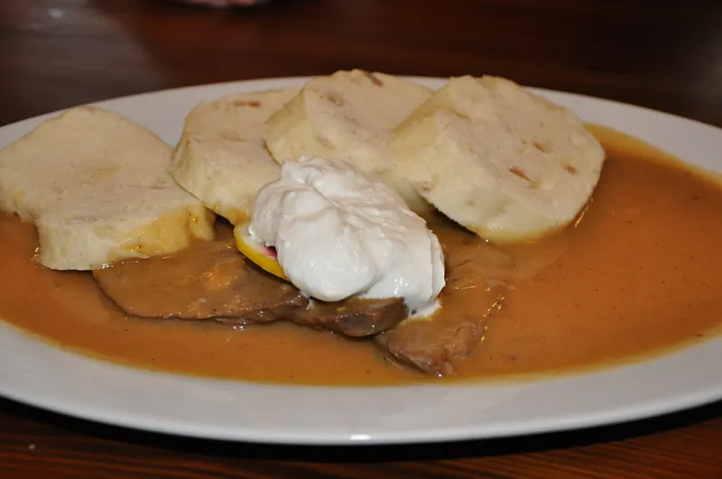 Svíčková, marinated beef in cream sauce with bread dumplings