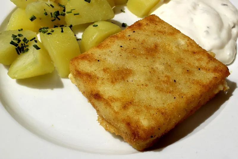 Smažený sýr, breaded fried cheese with tartar sauce and potatoes