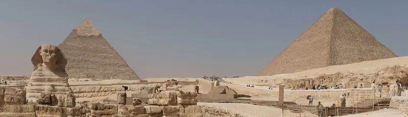 A panoramic desert view of the pyramids and Sphinx