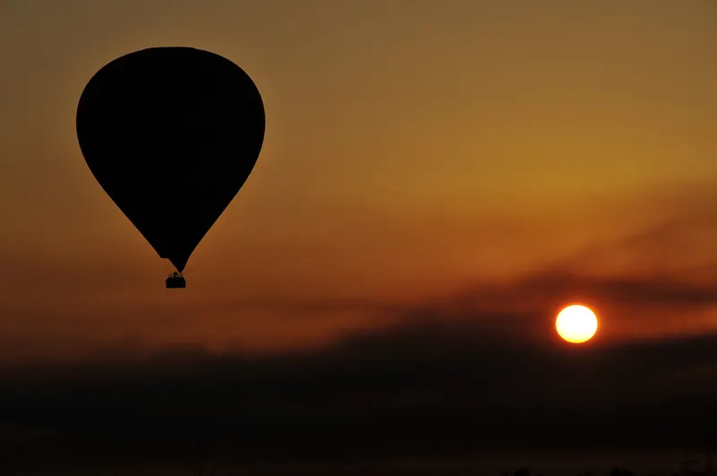 A hot air balloon flight over Luxor at sunrise
