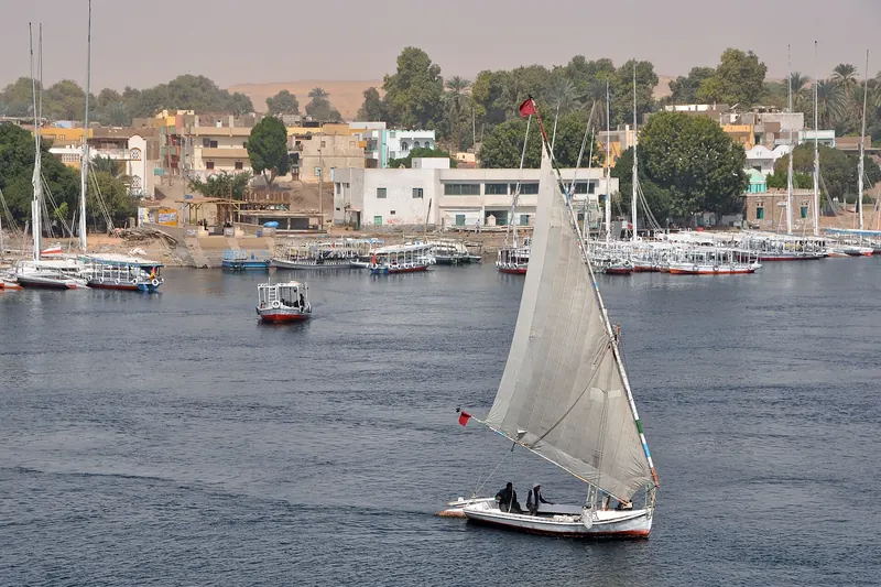 Watching the Nile riverbank from a cruise boat
