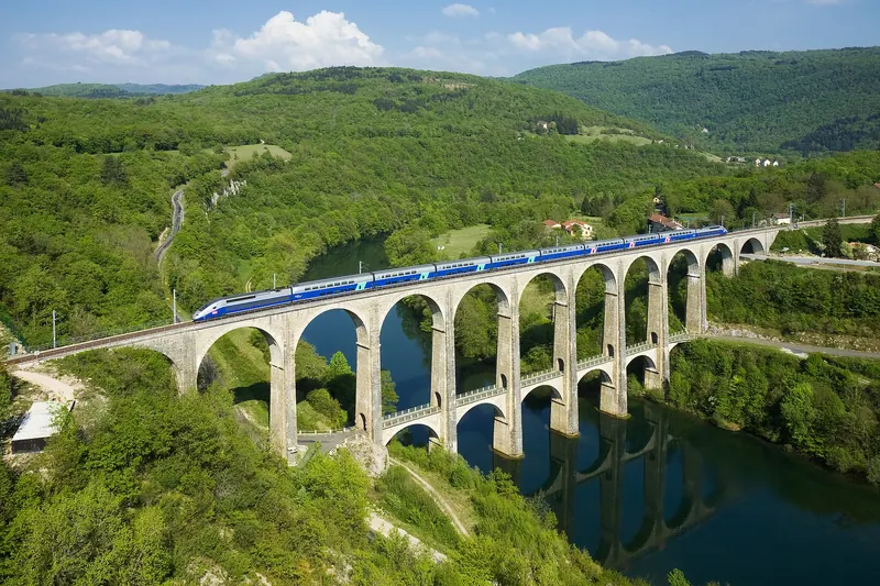 A TGV Duplex high-speed train crossing a viaduct