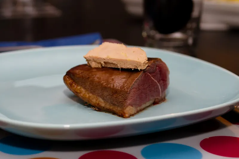 Magret de canard served with foie gras