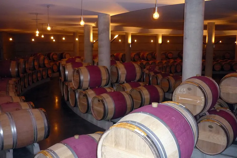 Barrels ageing in a Bordeaux château's chai