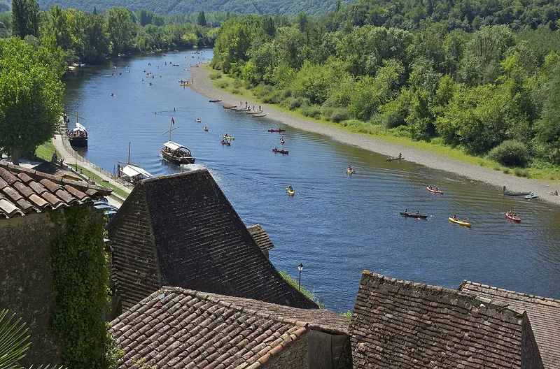 Traditional gabare boats on the river below La Roque-Gageac
