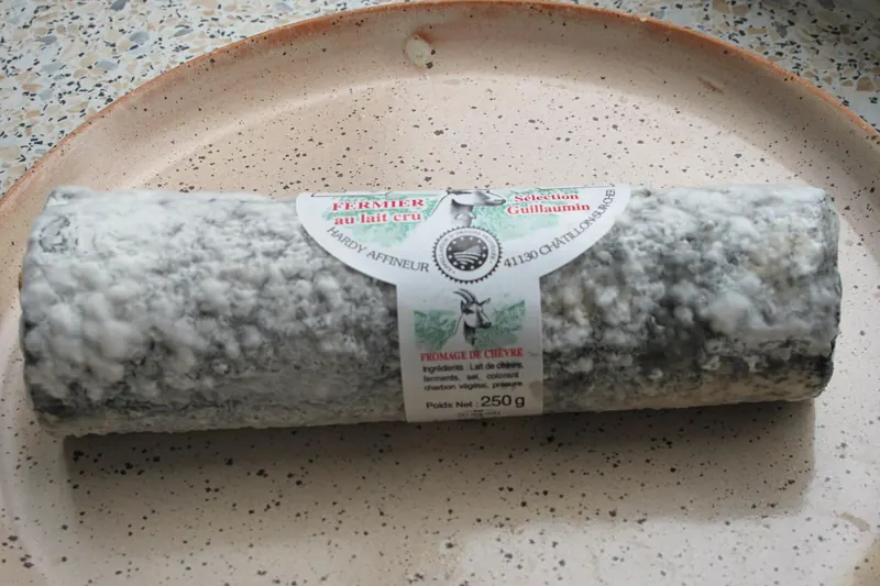 A log-shaped Sainte-Maure-de-Touraine goat's cheese