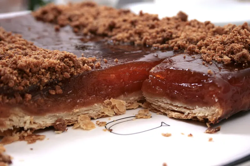 A close-up slice of caramelised apple tarte Tatin