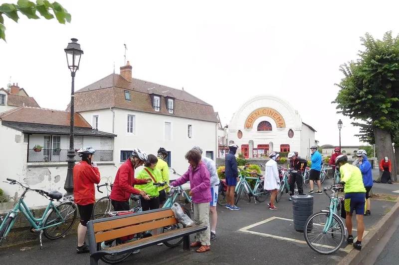 Cyclists stopped with their bikes in a Loire Valley village