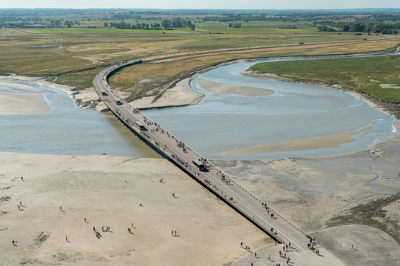 The raised bridge on piles leading across the bay to Mont-Saint-Michel