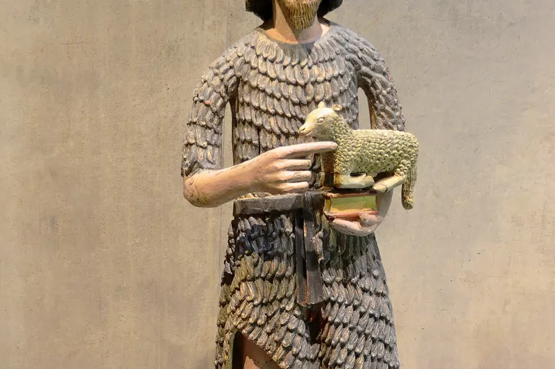 A polychrome wooden statue on display at the Scriptorial museum in Avranches