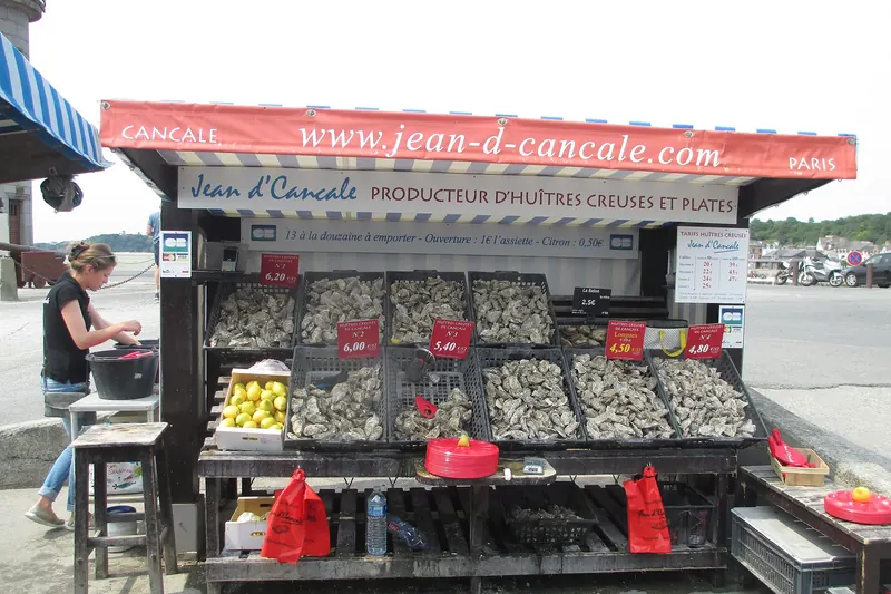 An oyster grower's stall selling by the dozen on the seafront at Cancale